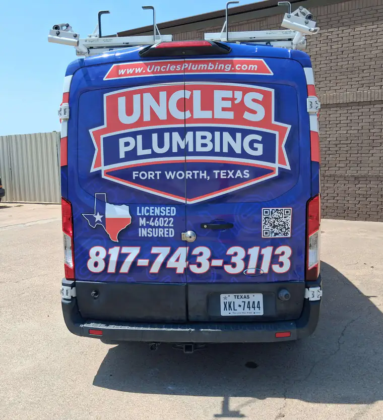 Rear doors of an Uncle's Plumbing van showing LICENSED, M-46022 and INSURED lettering
